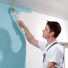 Decor-Union Service 005a Maler streicht mit Pinsel Wand mit blauer Farbe - Decor-Union Service 005a Maler streicht mit Pinsel Wand mit blauer Farbe 